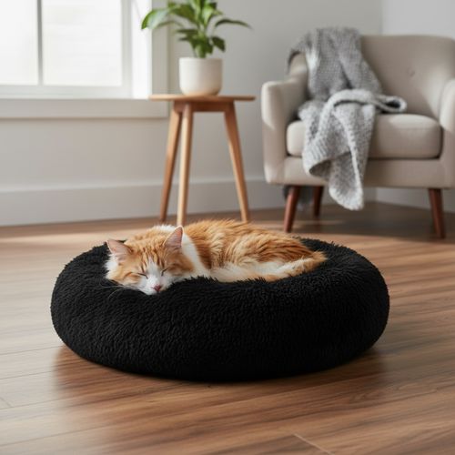 Black plush donut pet bed with cat in cozy living room
